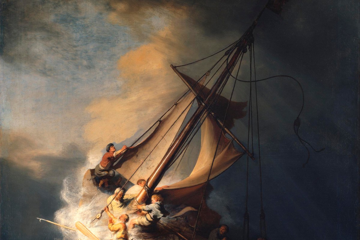 A dramatic painting of a small fishing boat tossed by enormous waves in a violent storm, its crew struggling with the sails and rigging.