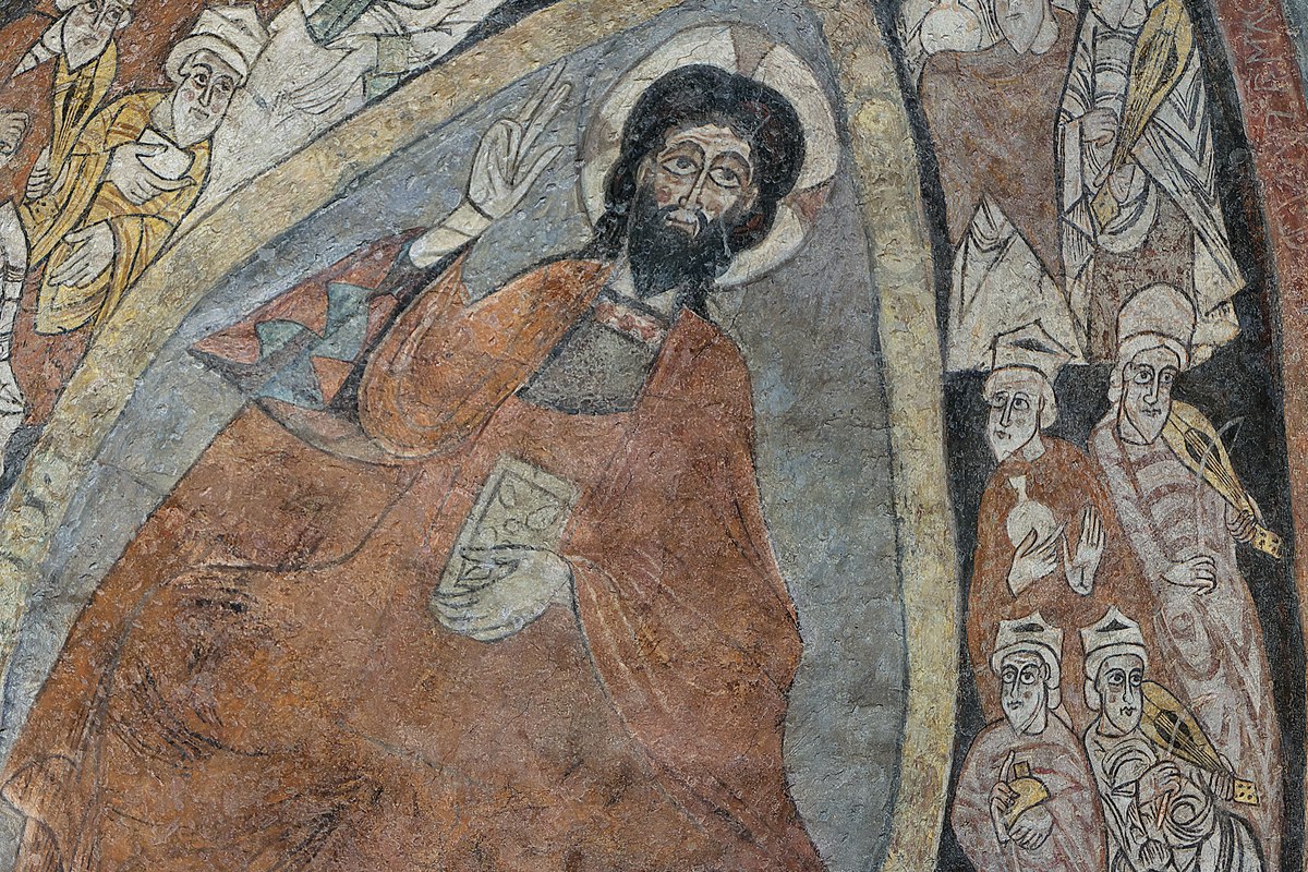 Un affresco medievale di Cristo in trono dentro una mandorla, una mano alzata in benedizione, circondato da figure di accompagnamento.