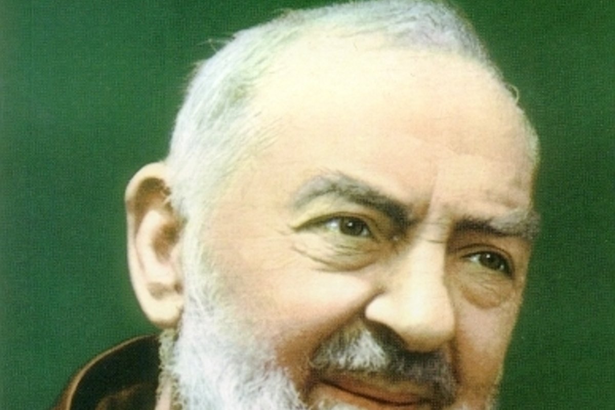 A photographic portrait of Padre Pio in his Capuchin habit, bearded and solemn, from the mid-20th century.