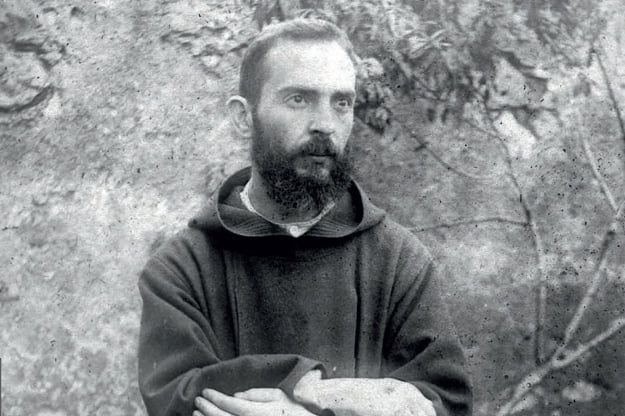 A 1919 photograph of a young Padre Pio showing his bandaged hands bearing the wounds of the stigmata
