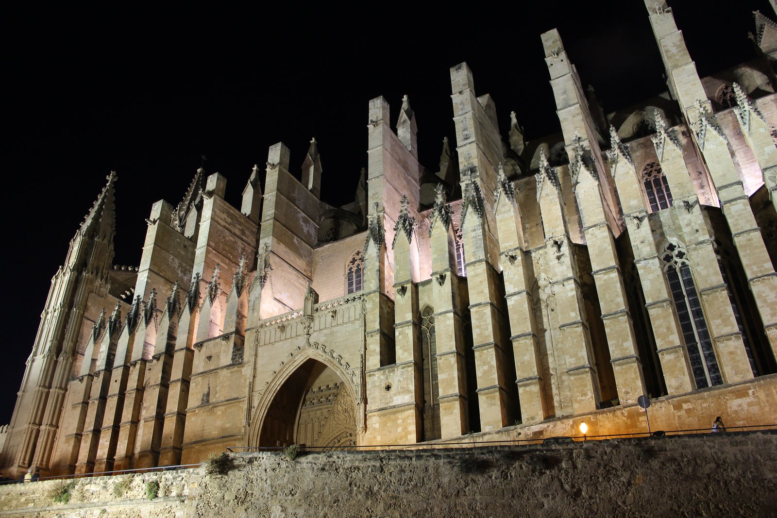 Palma de Mallorca Cathedral, known as La Seu, rising above the harbor and sea walls of Palma, Spain