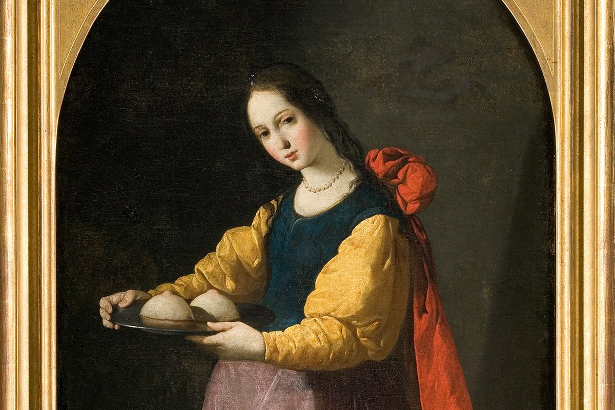 A young woman in a red robe holds a golden plate bearing her own severed breasts, gazing upward, in a Baroque devotional painting.