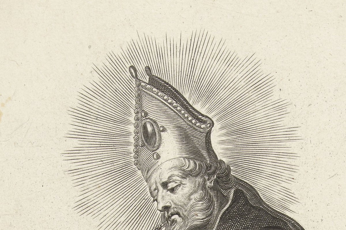 An engraving of a mitred, haloed bishop with a long beard gesturing downward toward a kneeling tonsured friar beside a column, with a Latin banner reading "Vocatis hunc bovem mutum" between them.