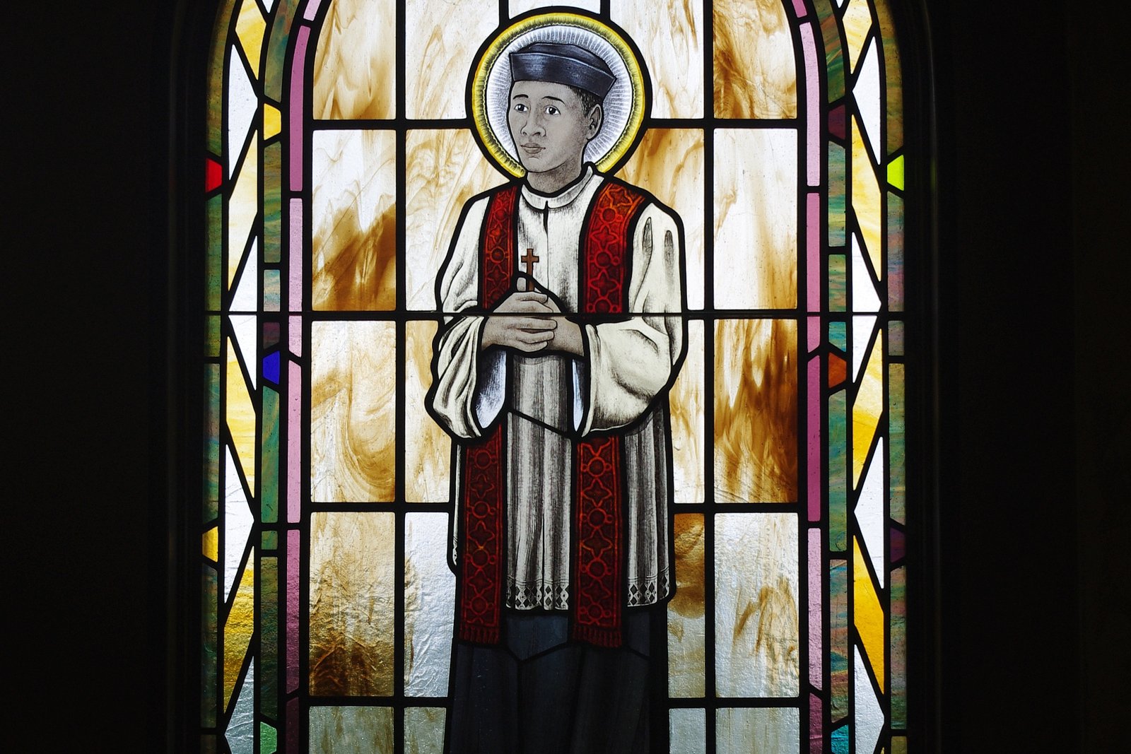 A stained-glass window depicting Saint Andrew Dũng-Lạc at Saint Paul Catholic Church in Westerville, Ohio.