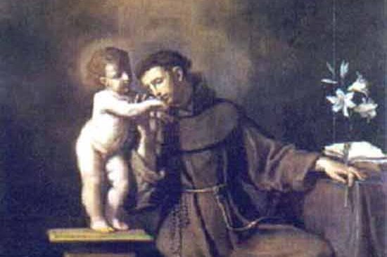 Saint Anthony of Padua kneeling before a vision of the Christ Child, with a lily and open book beside him