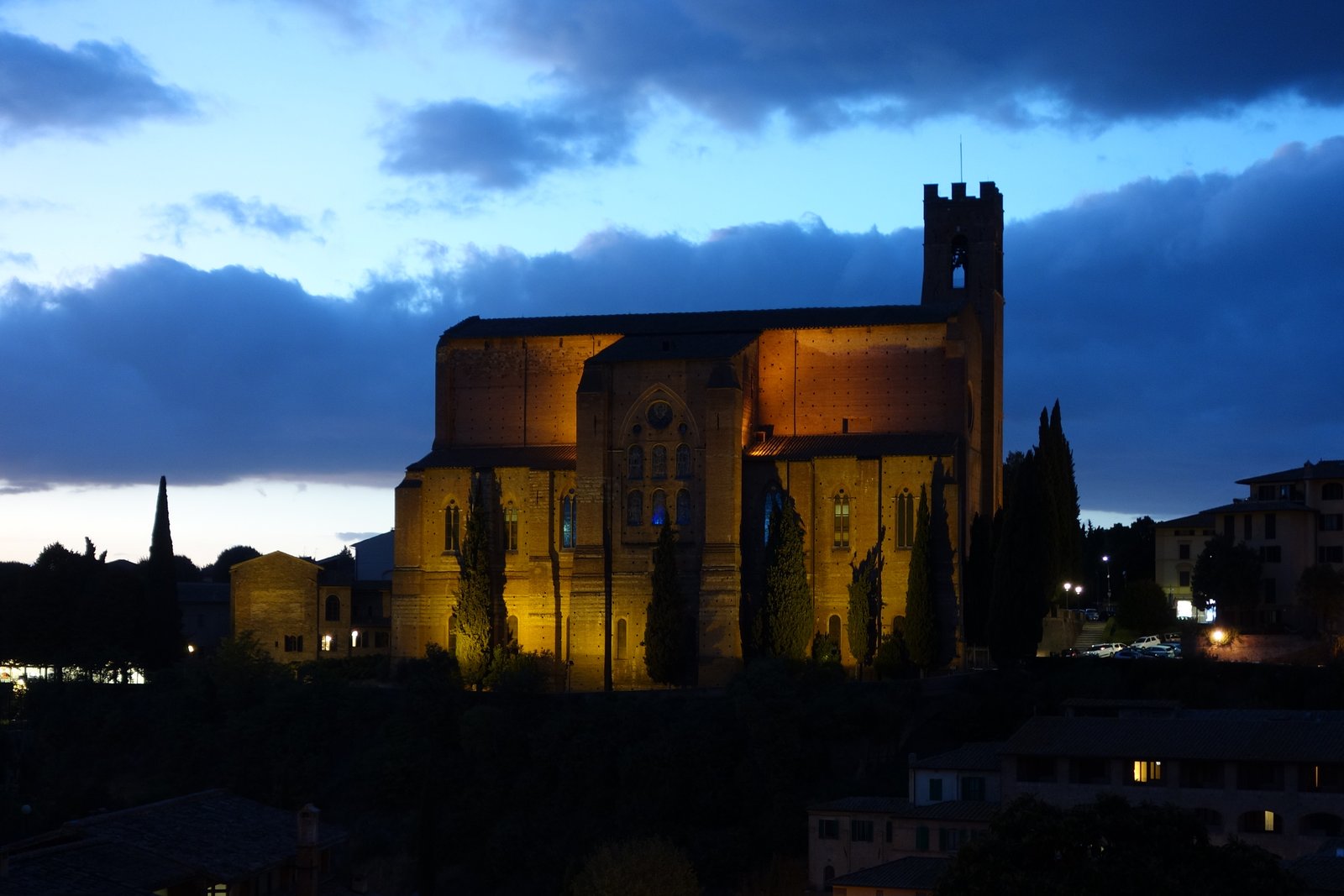 The Basilica of San Domenico in Siena, Italy, at dusk, where Saint Catherine's head is enshrined