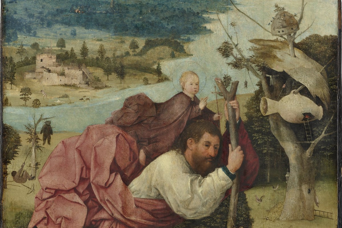 A large, muscular bearded man wading through a river carrying a small child on his shoulder, set against a wide landscape.