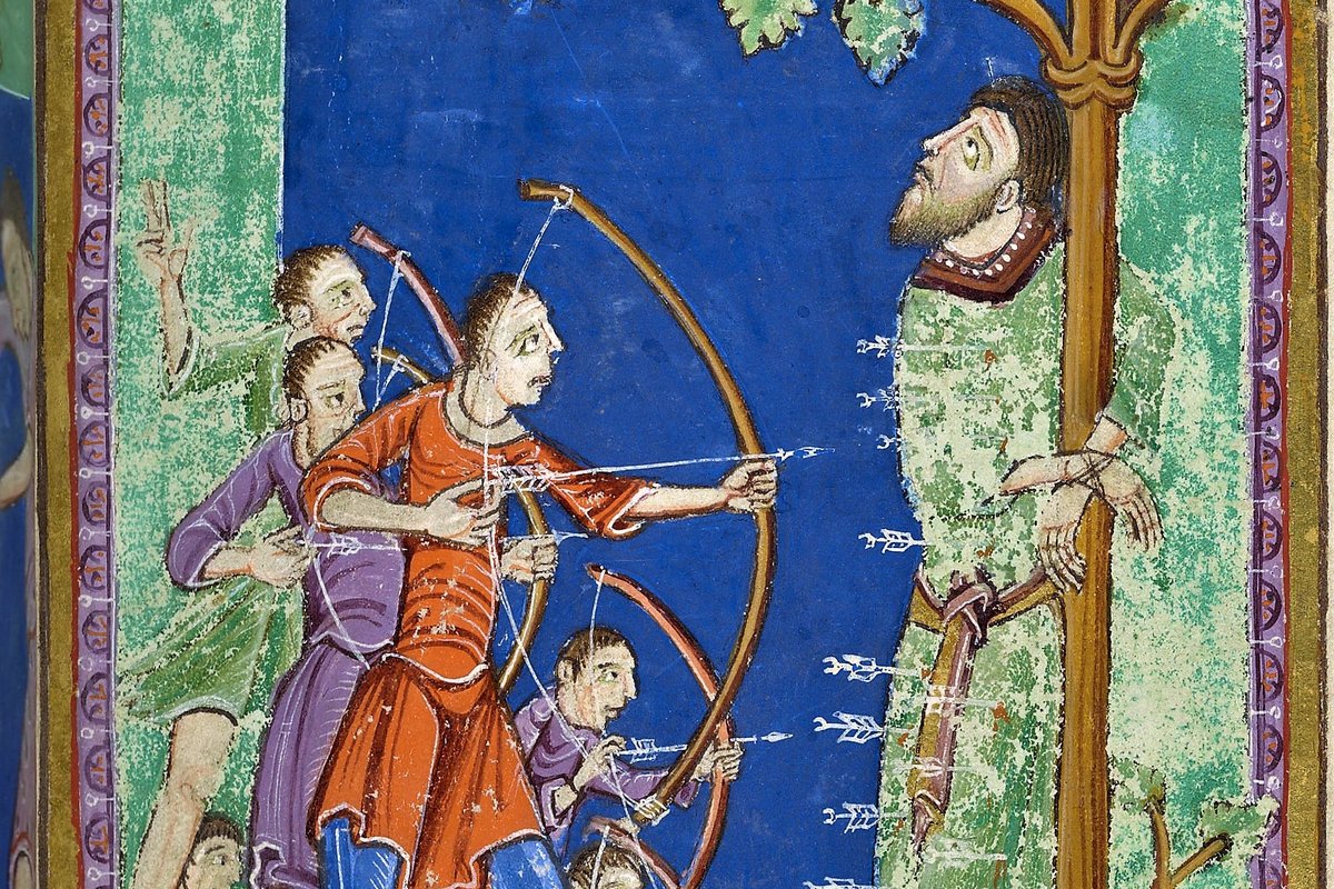 A medieval illuminated manuscript miniature of King Edmund tied to a tree, his face turned upward, as a row of Viking archers draw their bows and fire arrows into him.