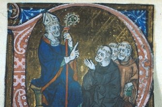 A medieval illuminated manuscript initial showing a mitred bishop saint teaching a group of tonsured monks, painted in gold and blue.