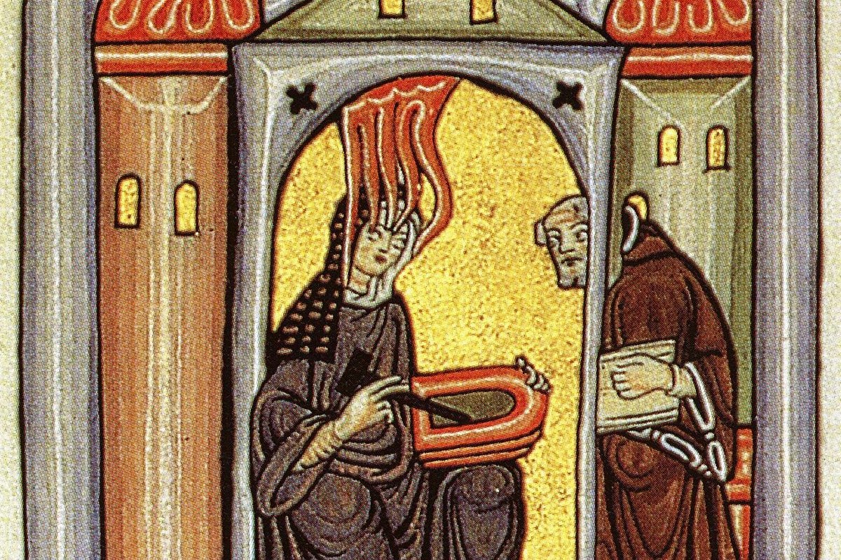 A medieval illuminated manuscript depicting a woman with flames rising from her head, dictating to a seated male scribe inside an ornate arched building.