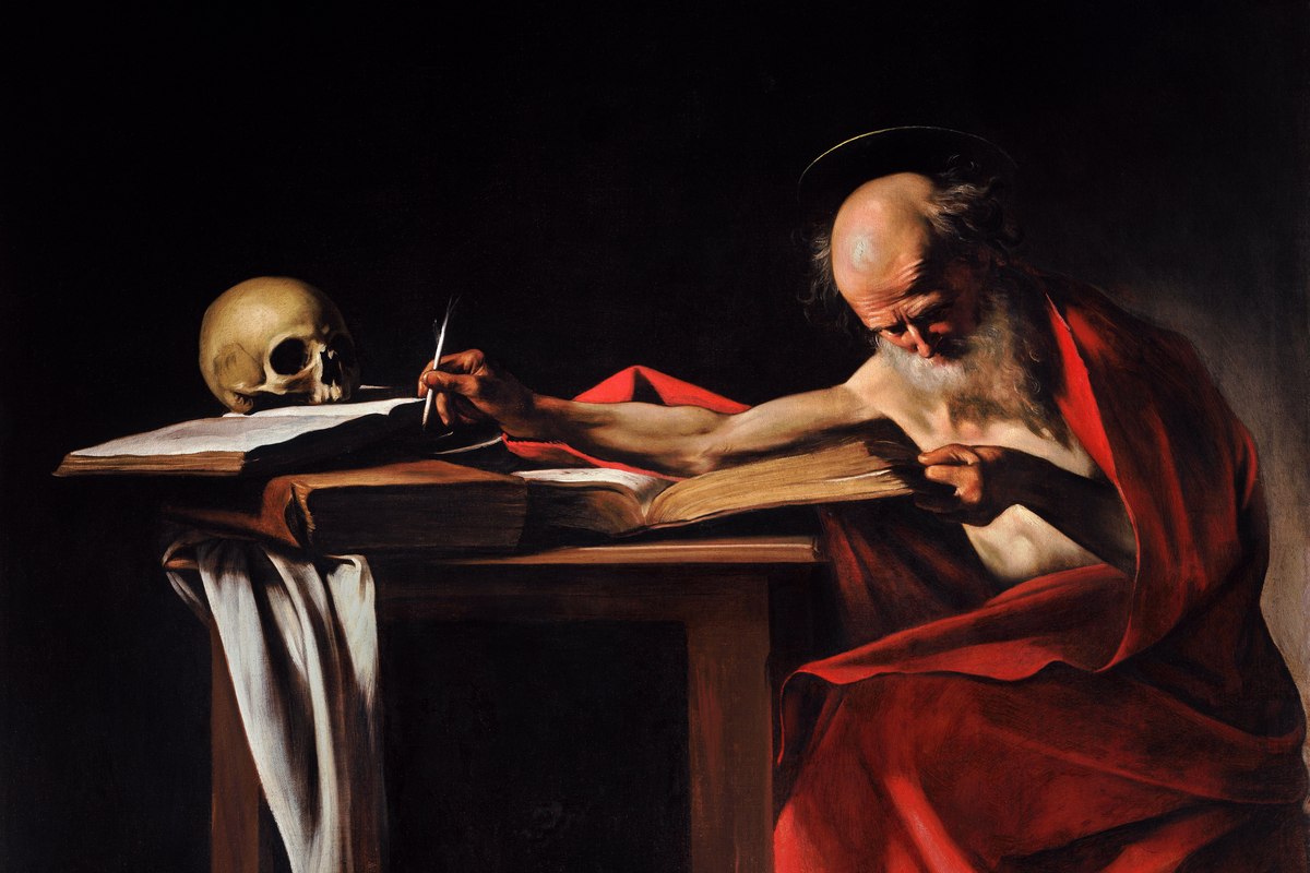 A dramatic painting of an elderly bearded man leaning across a wooden table, writing intently in a large book beside a human skull.