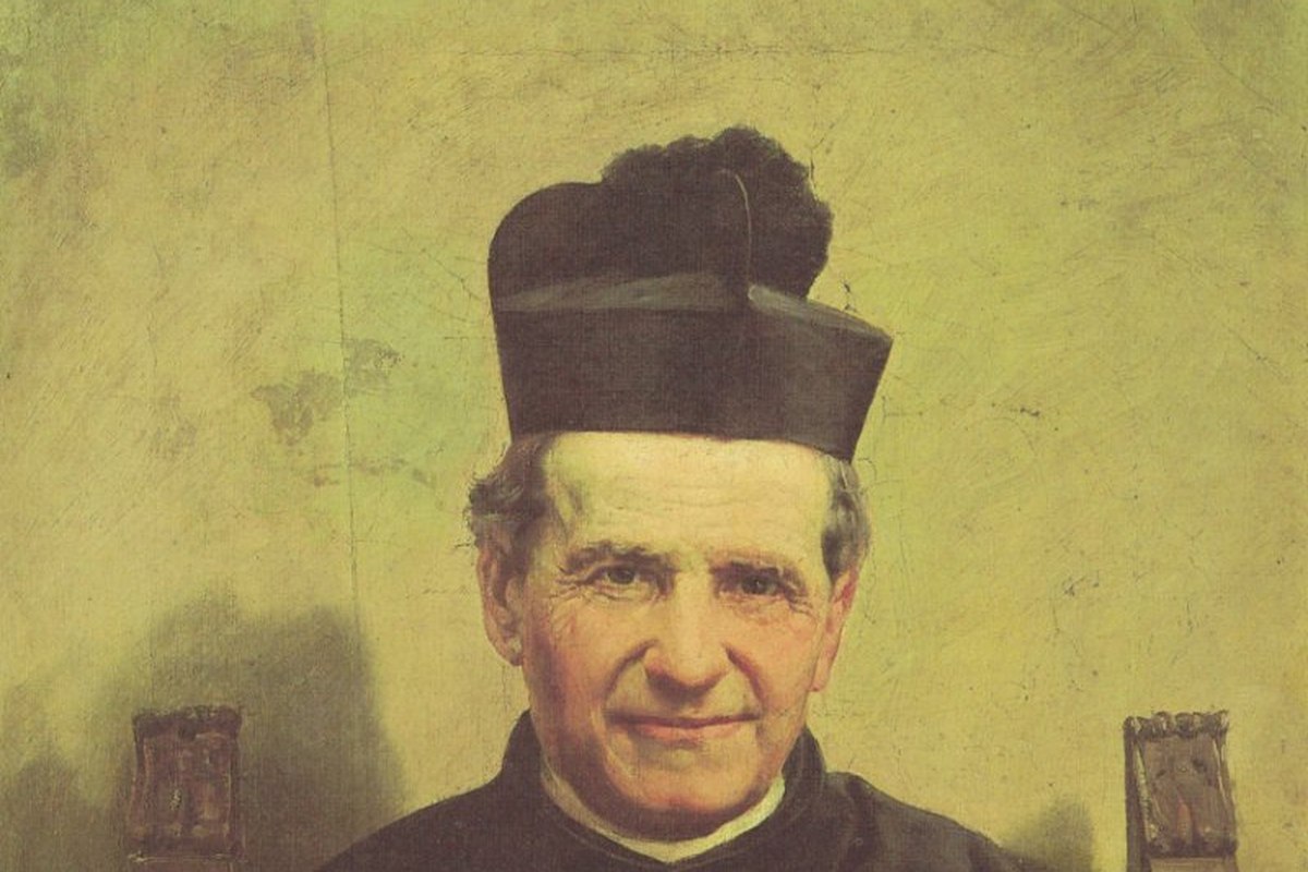 A portrait of a 19th-century Catholic priest with a warm, attentive expression, dressed in a black cassock.
