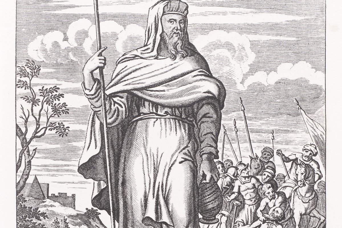 A 17th-century engraving of Saint John de Britto dressed as a Tamil ascetic, holding a pilgrim's staff and water pot, with a scene of his arrest and martyrdom depicted in the background.