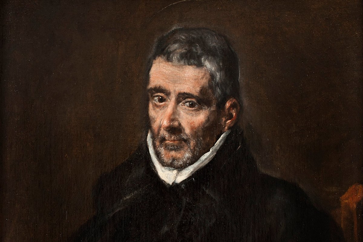 A close, somber portrait of a gray-haired, bearded Spanish priest in a black cloak with a white collar, gazing slightly to the side.