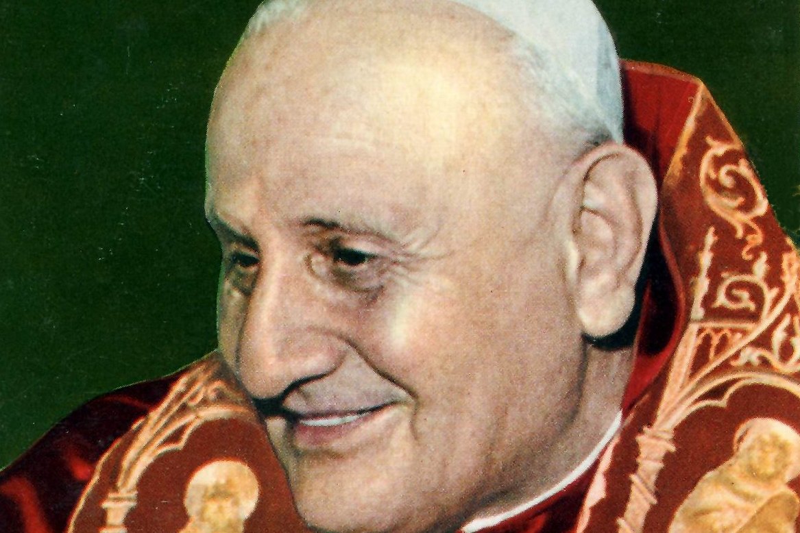 Photographic portrait of Pope John XXIII smiling, wearing red papal vestments, 1959
