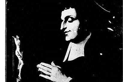 Black-and-white 19th-century engraving of Saint Louis-Marie Grignion de Montfort in clerical collar, hands folded in prayer before a small crucifix