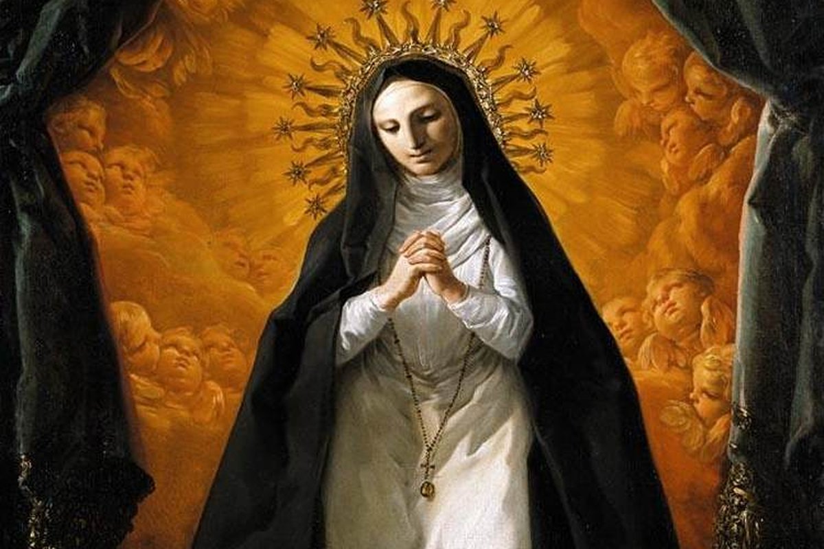 An 18th-century oil painting of a kneeling nun in black and white habit, hands folded in prayer, haloed by golden rays, with the Sacred Heart resting on an altar before her.