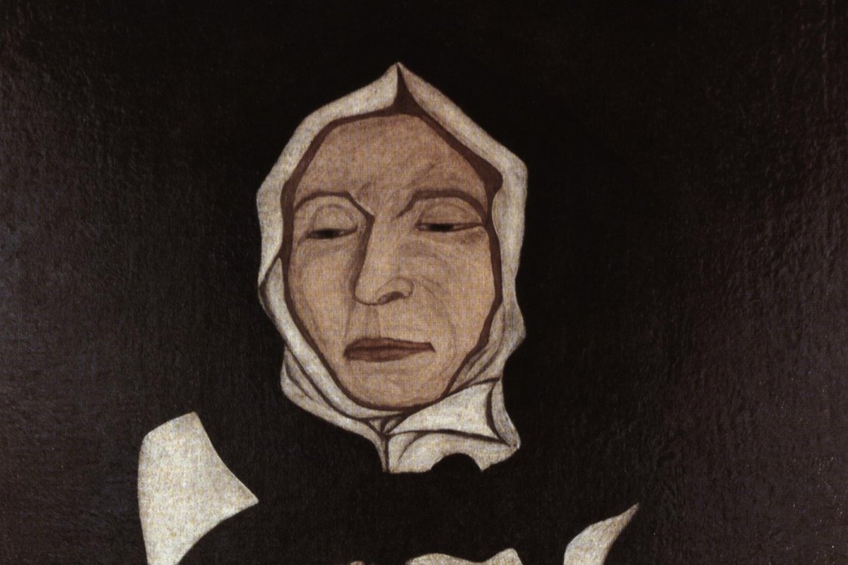 A somber 1700 portrait of an elderly nun in a white wimple and black habit, wearing a crucifix, her hands clasped in prayer.
