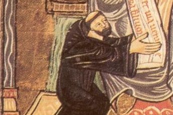 A medieval manuscript miniature showing a tonsured abbot in monastic robes seated and holding a book, with a decorative border.