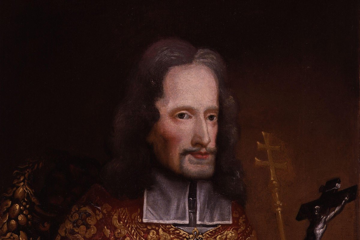 A 17th-century oil portrait of Archbishop Oliver Plunkett in an embroidered cope, holding a crucifix beside his bishop's mitre.