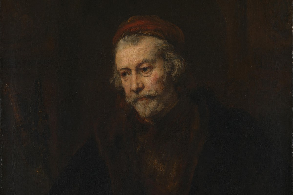 A Rembrandt portrait of an elderly, bearded man in dark robes, gazing thoughtfully to the side, painted with deep shadow and soft light.