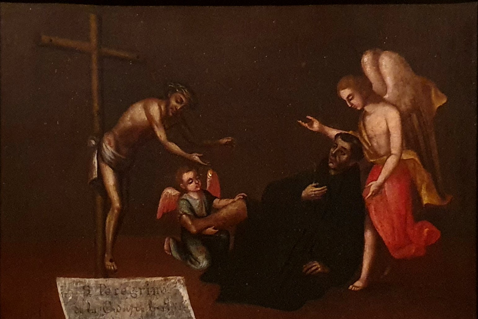 An 18th-century devotional painting showing a kneeling friar in a black habit before a crucifix, with an angel touching his leg and a young angel attending nearby.