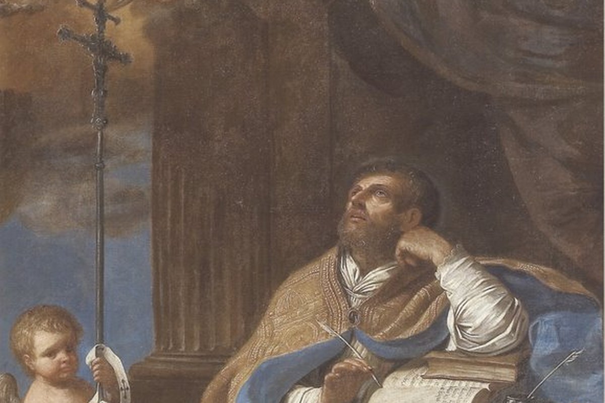 A bishop in gold vestments seated in a chair, looking upward with a quill in hand over an open book, accompanied by two small angels holding a crucifix.
