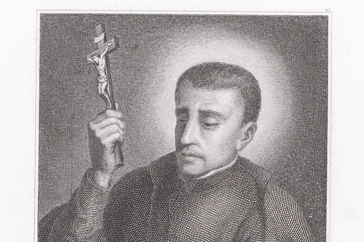A 19th-century engraved portrait of a Jesuit priest in a habit, holding up a small crucifix, with a halo rendered as a glow behind his head.