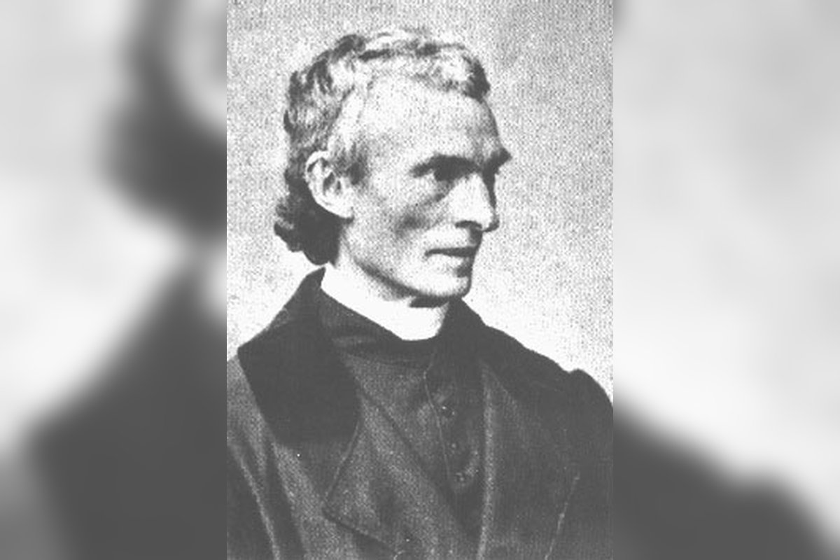 A black-and-white photographic portrait of Saint Peter Julian Eymard, wearing clerical dress with a cross visible at his chest.