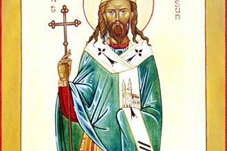 An old engraved illustration of a bearded bishop saint in monastic robes, holding a staff, in a simple landscape setting.