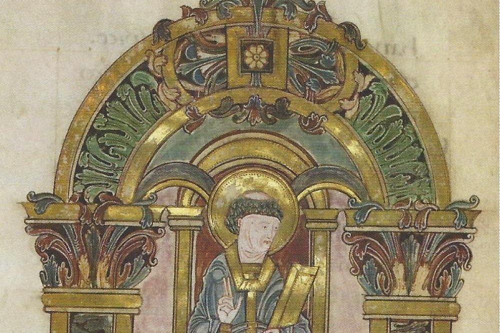 A tenth-century illuminated manuscript miniature of a bishop-saint in gold and blue vestments, holding a book.
