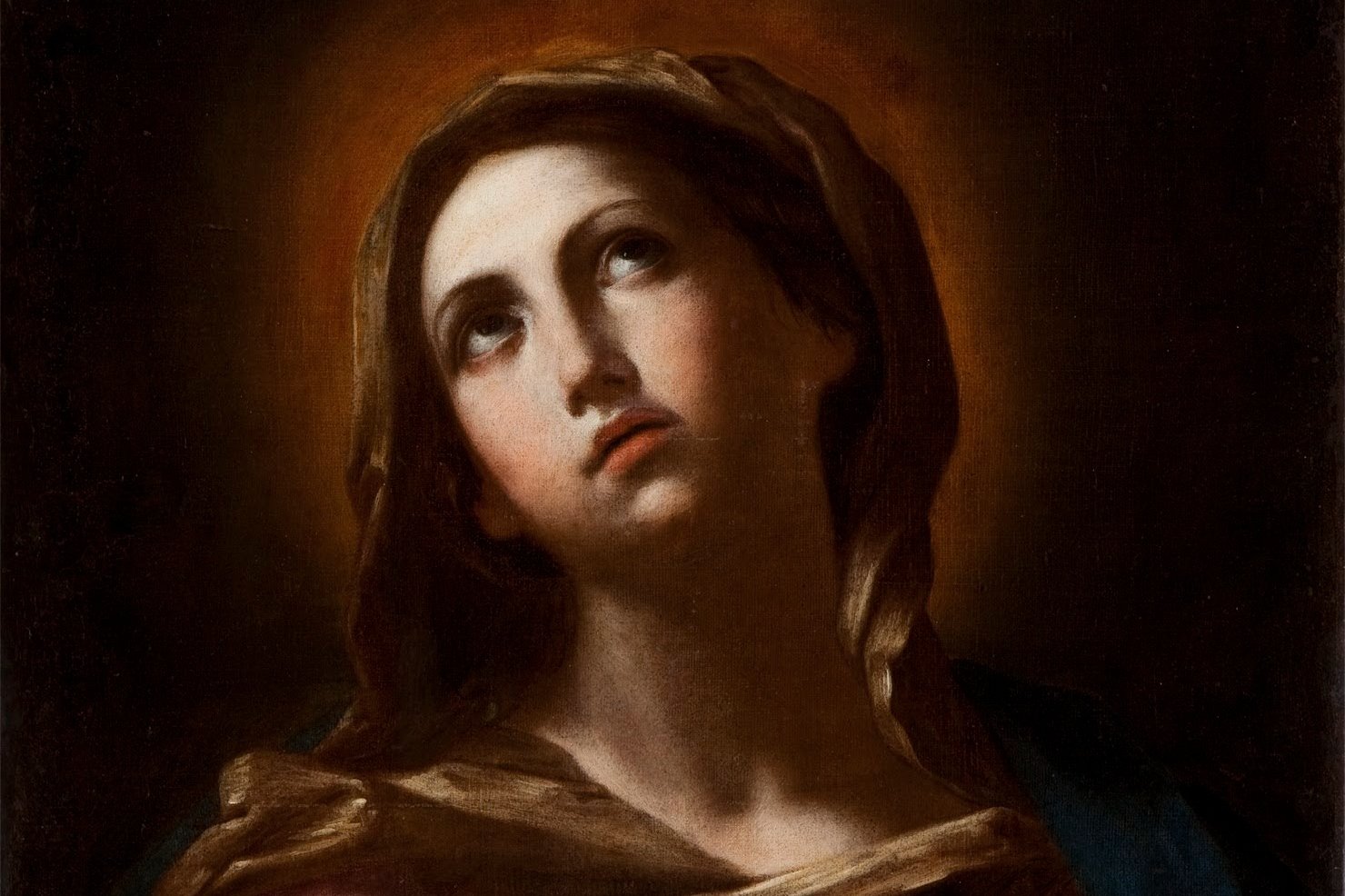 Carlo Dolci's portrait of the Virgin Mary in prayer, hands joined, eyes raised to heaven, wrapped in a blue mantle against a dark background.