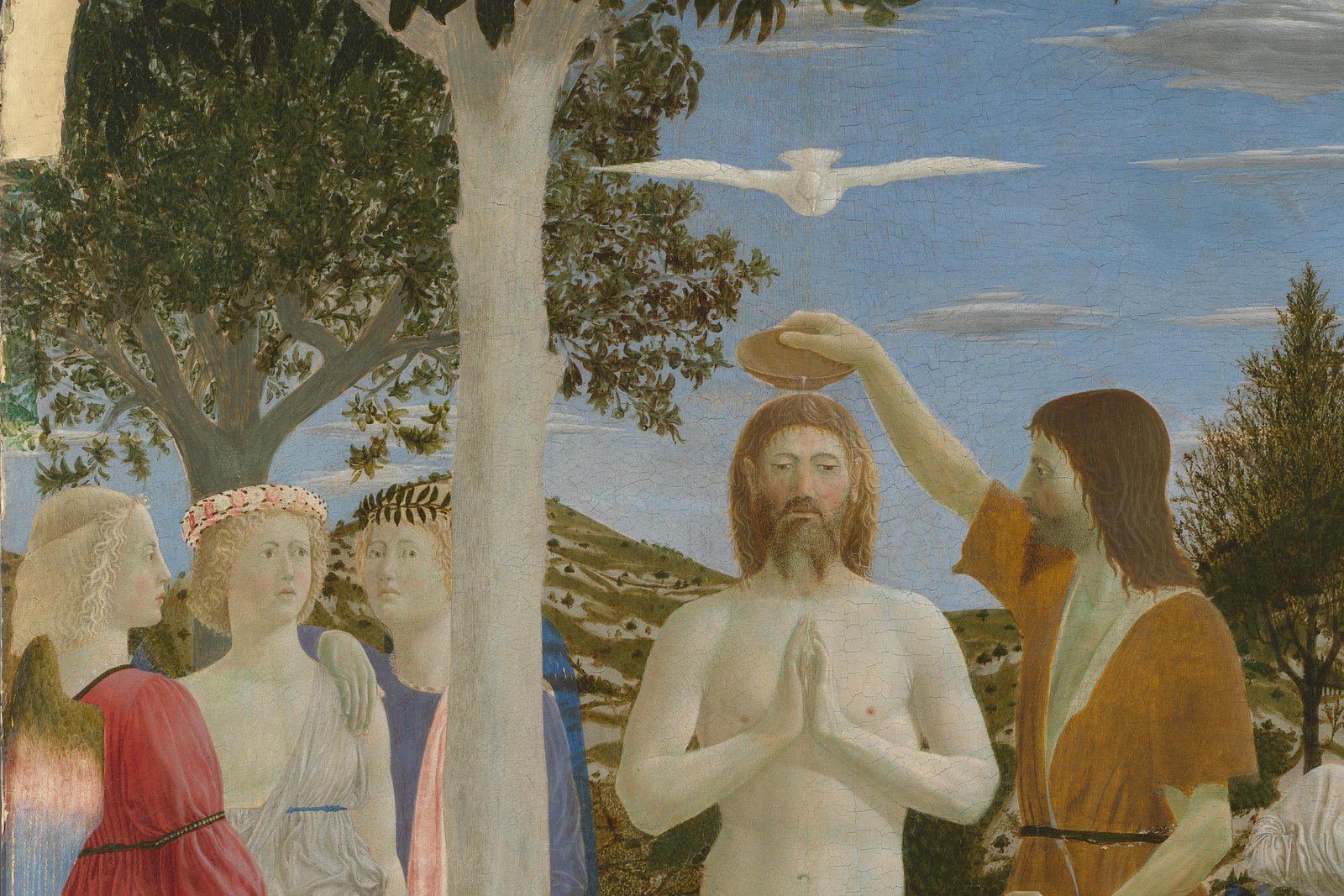 Piero della Francesca's Baptism of Christ, showing Jesus standing in the Jordan River with hands joined in prayer as John the Baptist pours water over his head and the dove of the Holy Spirit descends.