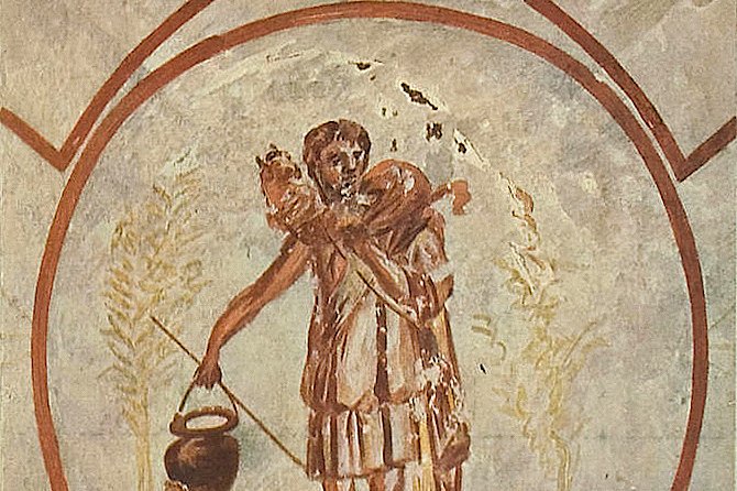 Ancient fresco of the Good Shepherd, a beardless young man carrying a lamb on his shoulders, painted on the ceiling of the Catacomb of Priscilla in Rome.