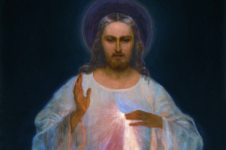 The original 1934 Divine Mercy painting by Eugeniusz Kazimirowski, showing Christ in a white robe with his right hand raised in blessing, red and pale rays streaming from his heart