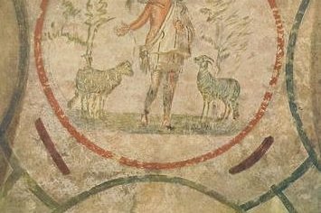 Early Christian fresco of the Good Shepherd, a beardless young man carrying a lamb on his shoulders, from the Catacomb of Priscilla in Rome.