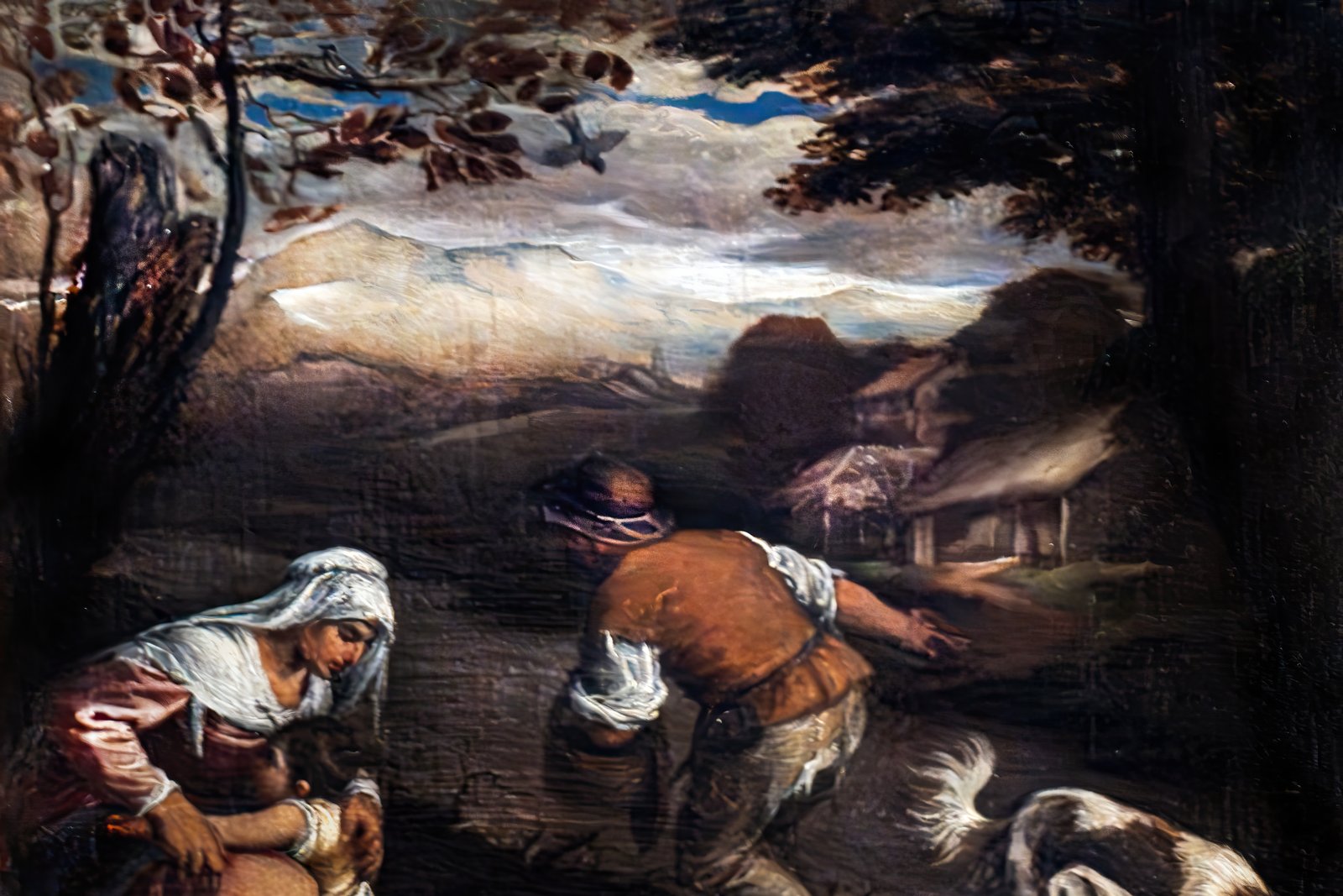 A Renaissance painting of a farmer scattering seed by hand across a field, with a village and rolling landscape visible in the background.