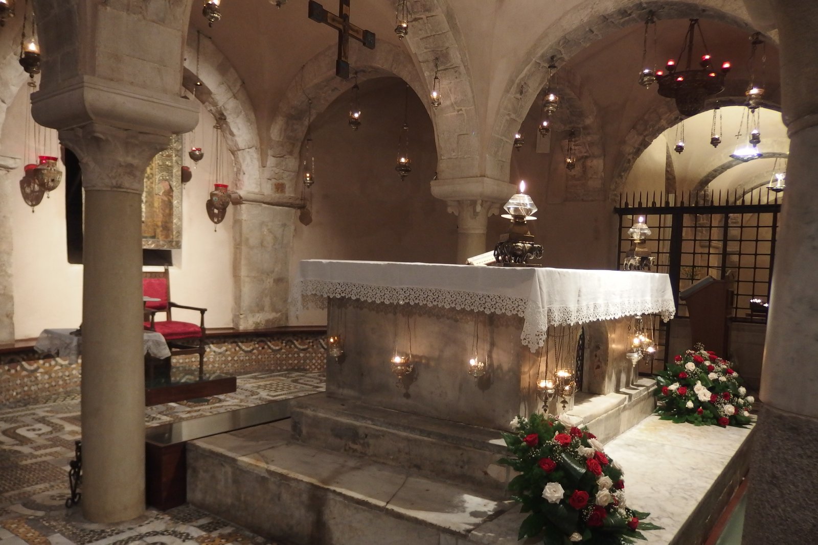 The tomb of Saint Nicholas in the crypt of the Basilica of San Nicola, Bari, Italy, where pilgrims venerate his relics