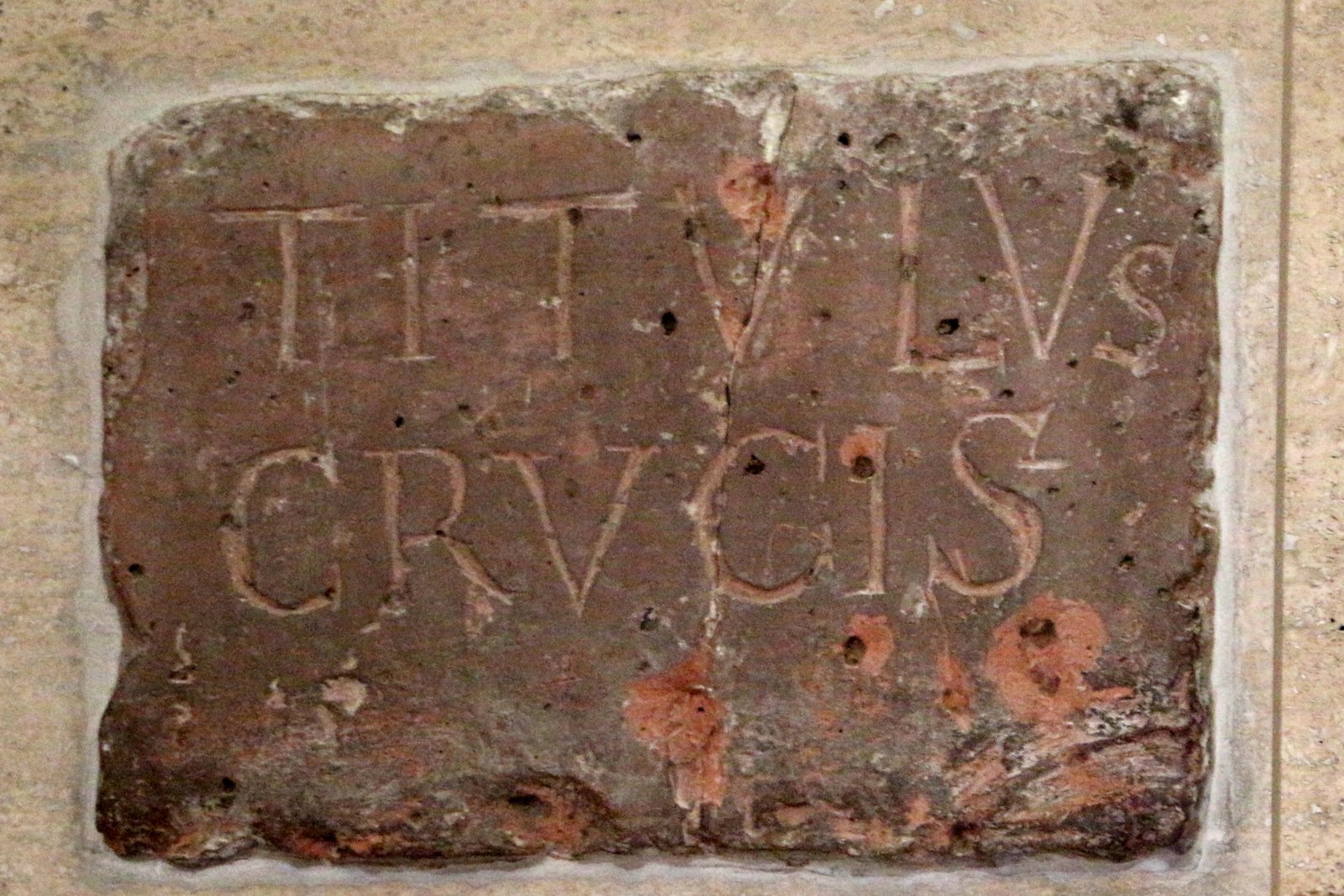 The marble plaque marking the relic chapel of the Titulus Crucis at the Basilica of Santa Croce in Gerusalemme, Rome