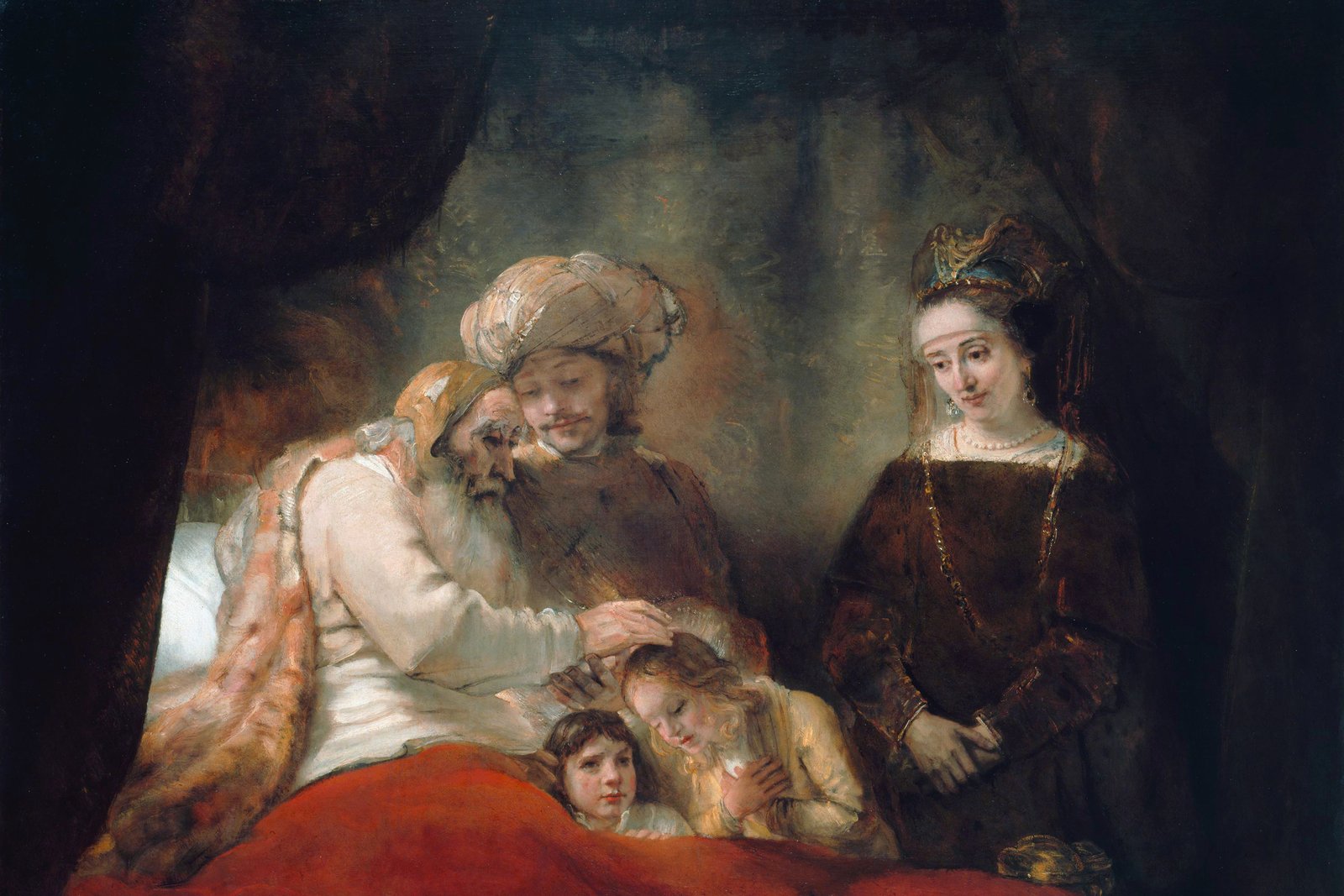 Rembrandt painting of the elderly patriarch Jacob laying his hands on his grandsons to bless them, with Joseph and his wife looking on.