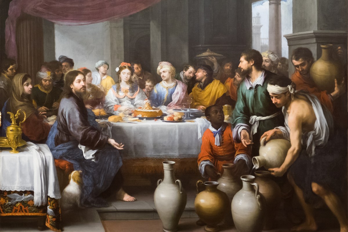 A baroque painting of a crowded wedding banquet, with servants pouring water from large jars in the foreground and Jesus seated at the table.