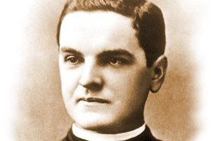 A black-and-white studio portrait photograph of Father Michael J. McGivney, a young priest in clerical collar, taken before 1890.