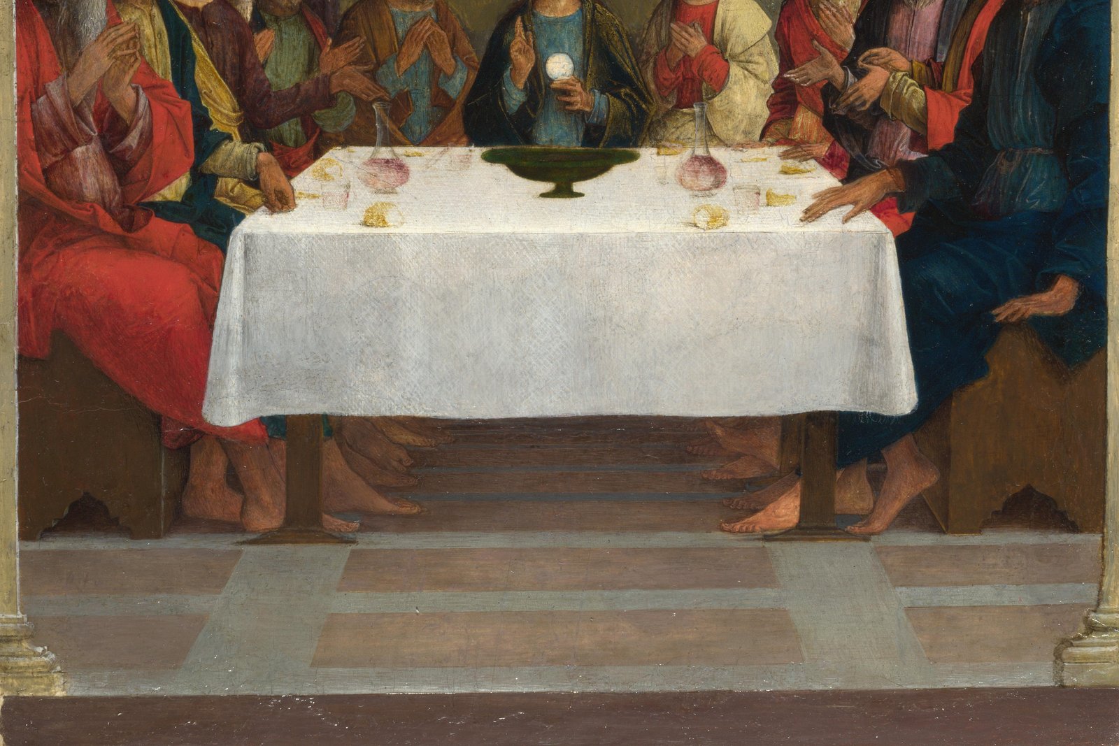 A Renaissance painting of the Last Supper, with Christ holding the host at the institution of the Eucharist.